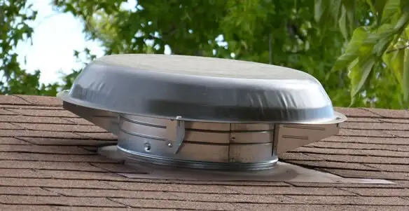 attic fan installation services with low-profile roof ventilation unit in Cambridge, MA