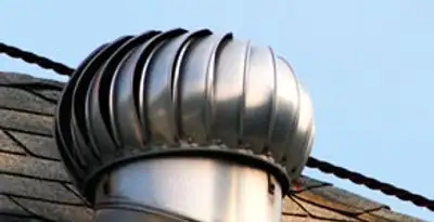 attic fan installation services with professionally installed roof ventilation unit in Cambridge, MA