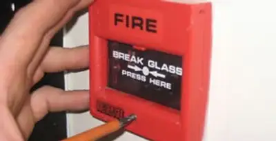 fire alarm installation service showing manual fire alarm pull station installed by licensed electricians in Cambridge, MA