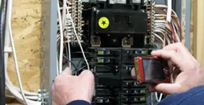 Home electrical inspection of circuit breaker panel by licensed electrician in Cambridge, MA