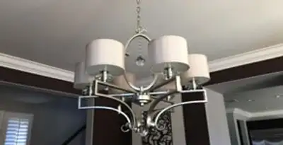 Modern chandelier installation with multiple light fixtures in Cambridge, MA