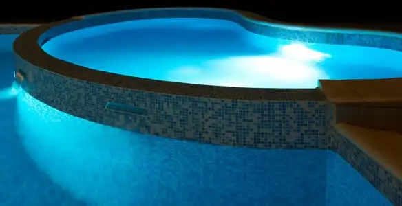 pool light installation and repair services highlighting illuminated pool interior lighting in Cambridge, MA