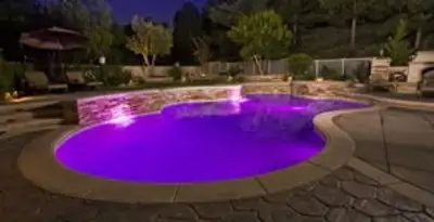 pool light installation and repair services illuminating a residential swimming pool in Cambridge, MA