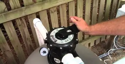 pool pumps service showing professional adjustment of pool pump control system in Cambridge, MA