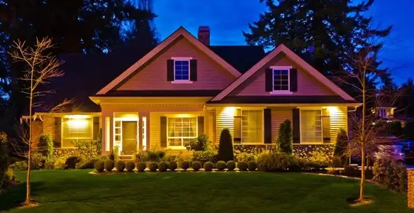 security light installation services illuminating a residential exterior at night in Cambridge, MA