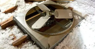 whole house fan installation services with attic-mounted ventilation unit in Cambridge, MA